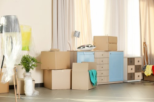 Office removals team preparing desks and boxes for a workplace move in Tofrance