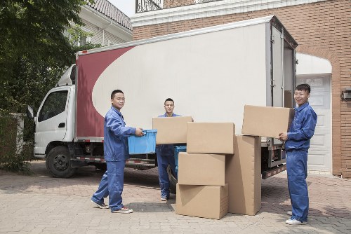 Removals team sorting recyclable packing materials at a transfer station