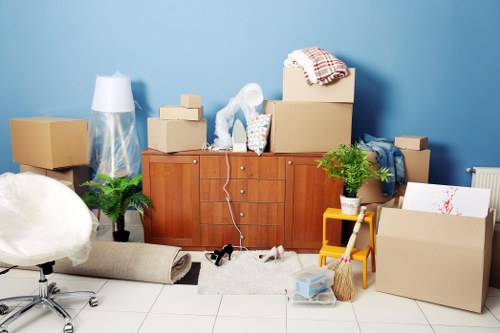 Packed household boxes and furniture ready for transport in Tofrance