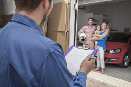 Team member handling belongings with PPE and training