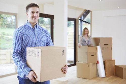 Removal van and moving team in a Tofrance residential street