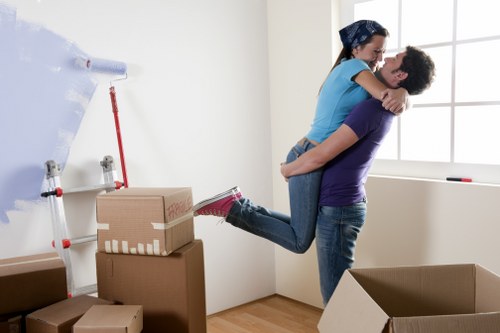 Unpacking boxes and arranging essentials in a new Tofrance property