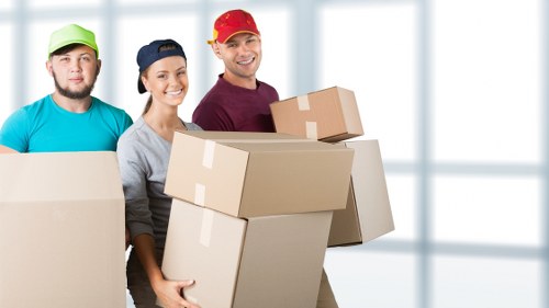 Team assessing lifting risks before handling furniture