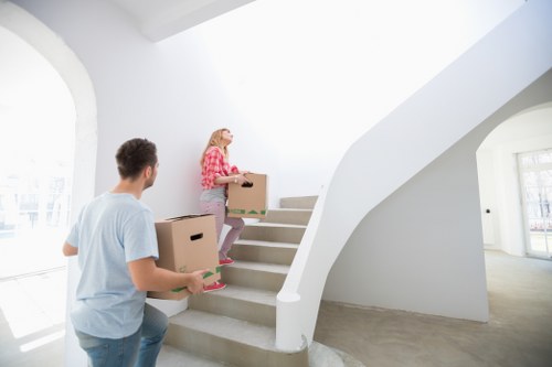 Movers handling a staircase access challenge in a Tofrance apartment building