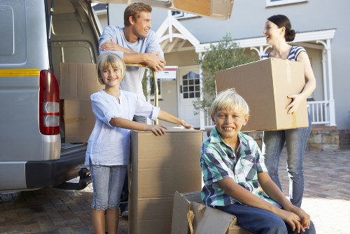 Loading household furniture into a van for a move in Tofrance