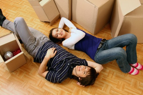 Professional movers handling furniture for a residential move in Tofrance