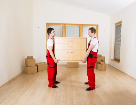 Packed boxes and furniture loaded into a removal van